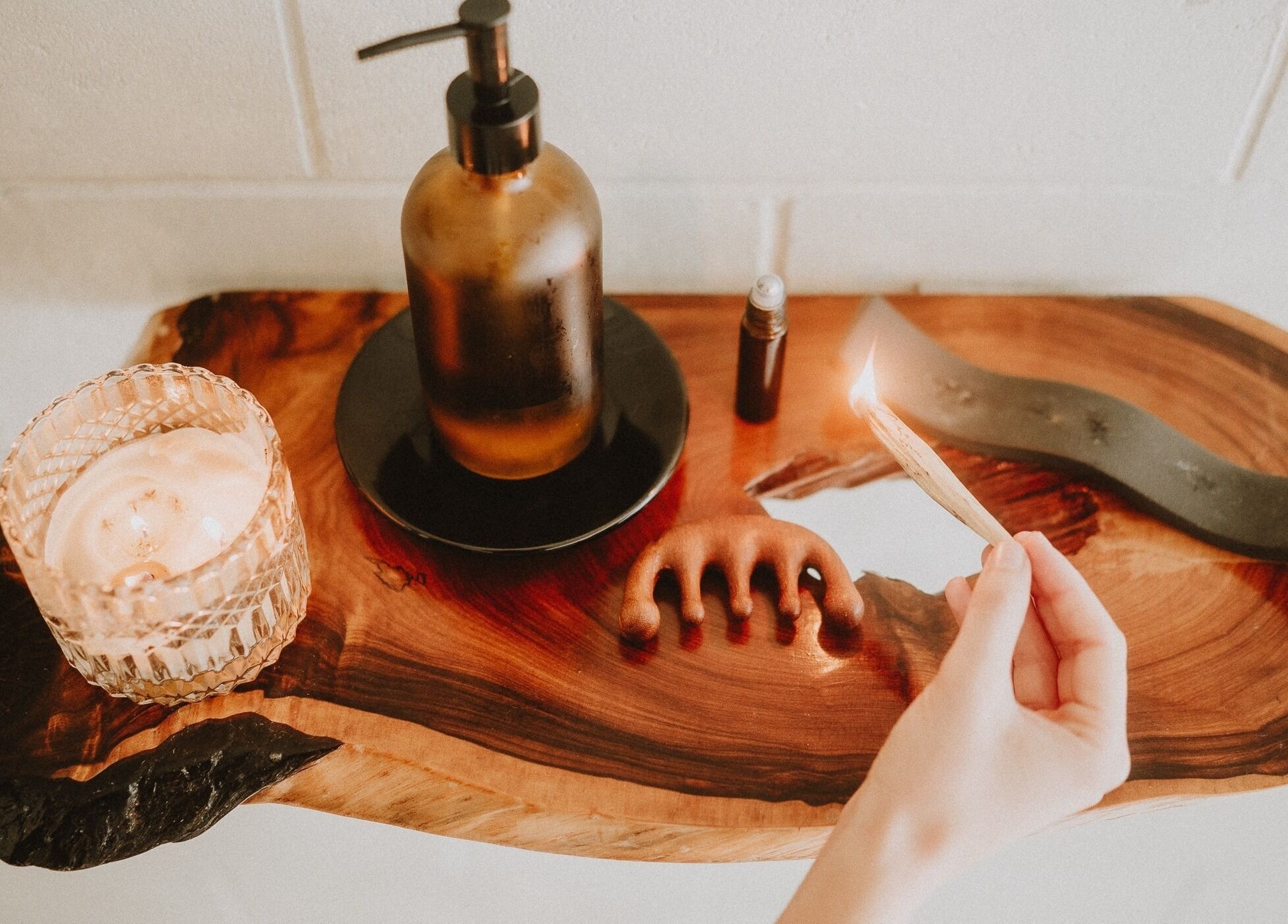 Nurture Massage's calming setup with candle and oils in Byron Bay, New South Wales, AU.