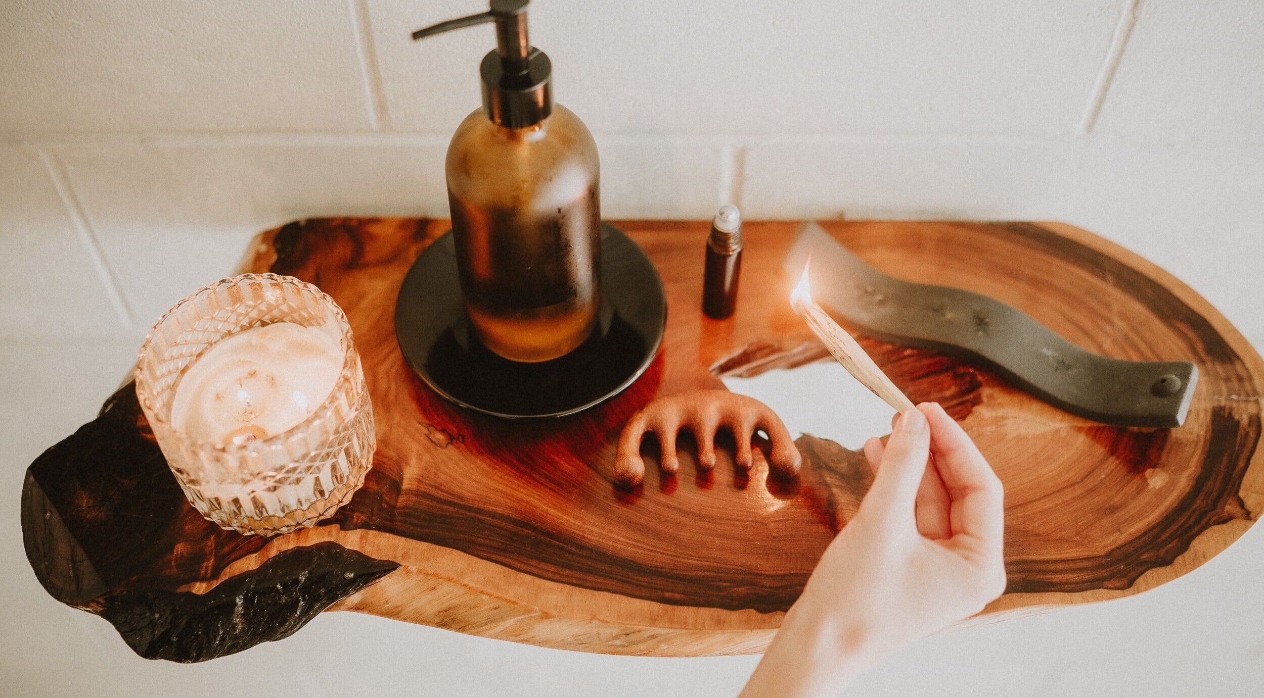 Nurture Massage's calming setup with candle and oils in Byron Bay, New South Wales, AU.