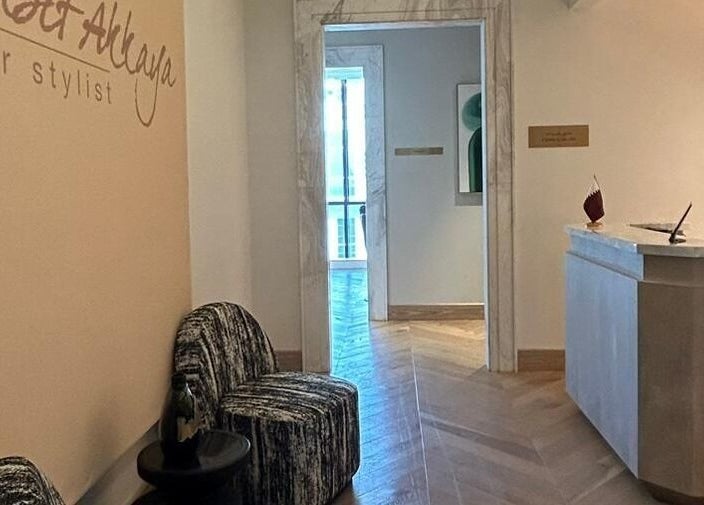 Chic reception area of AlSagheer Salon, Doha, Doha Municipality, QA with stylish seating and minimalist decor.