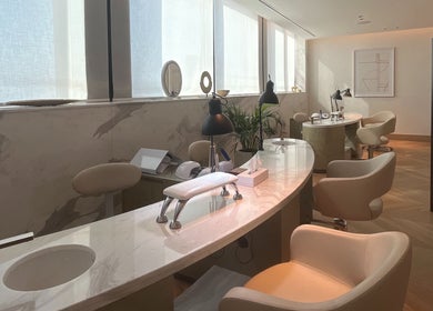 Sleek nail tables with modern chairs at AlSagheer Men Salon, Doha, Doha Municipality, QA, offering premium services.