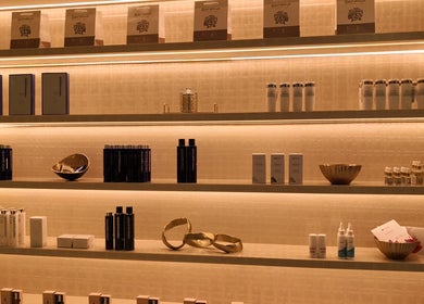 Shelves with grooming products at AlSagheer Men Salon, Doha, Doha Municipality, QA, showcasing top brands.