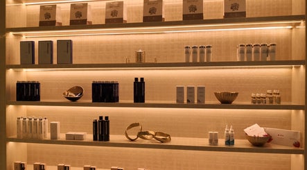 Shelves with grooming products at AlSagheer Men Salon, Doha, Doha Municipality, QA, showcasing top brands.