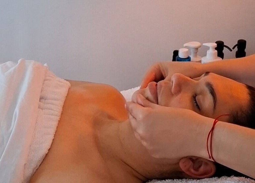 Calming facial massage at Golden Tree Holistic Therapies in Tuffley, England, GB. Relaxation and wellness focus.