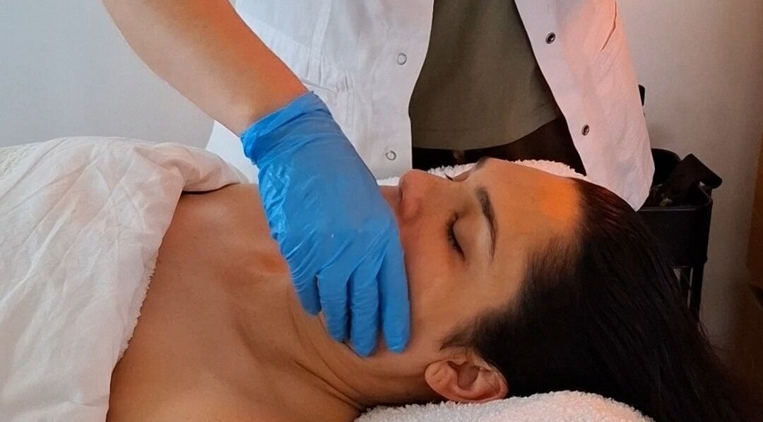 Relaxing facial massage at Golden Tree Holistic Therapies, Tuffley, England, GB promoting wellness and serenity.