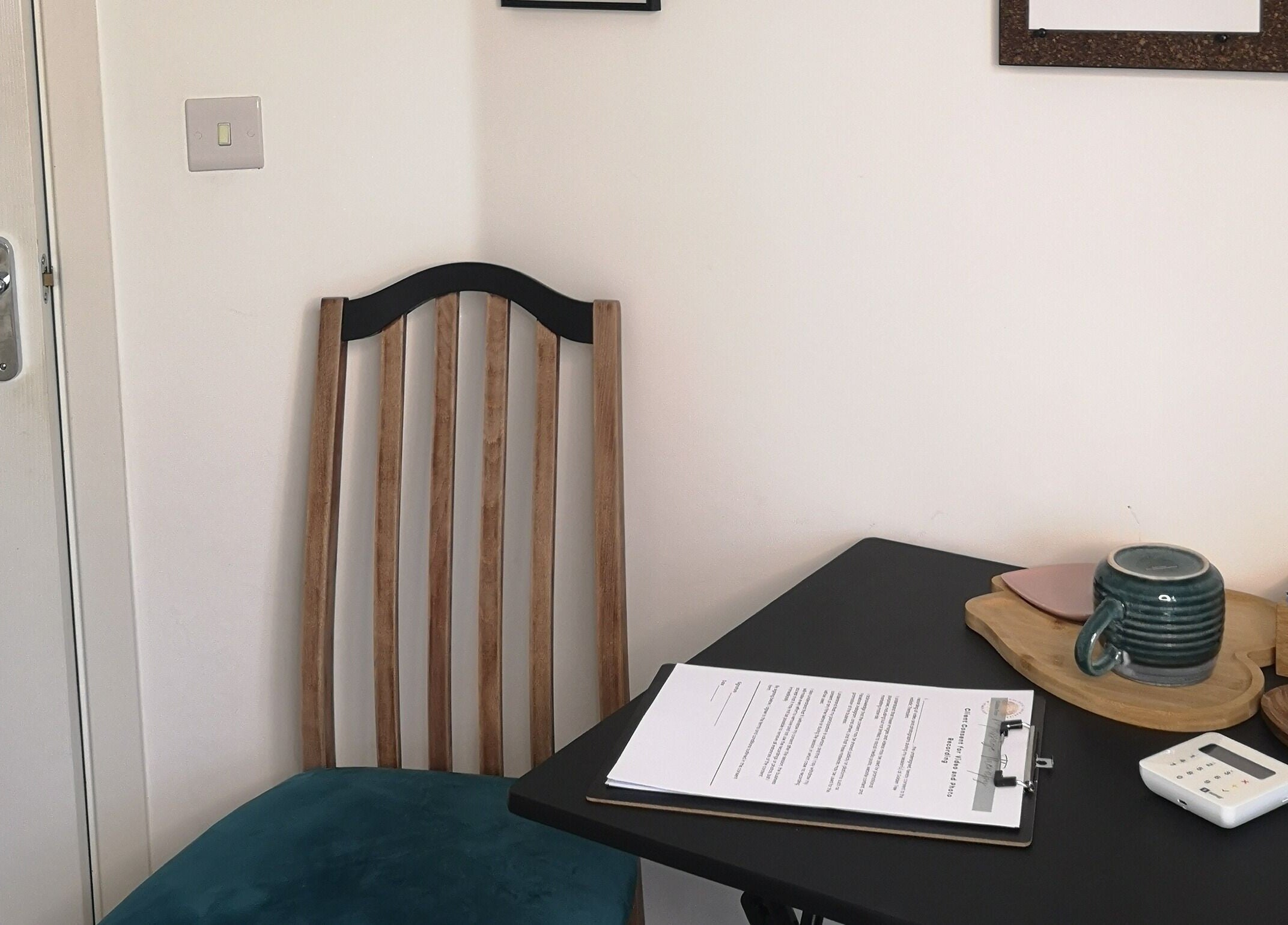 A serene consultation space at Golden Tree Holistic Therapies in Tuffley, England, GB with a chair and table.