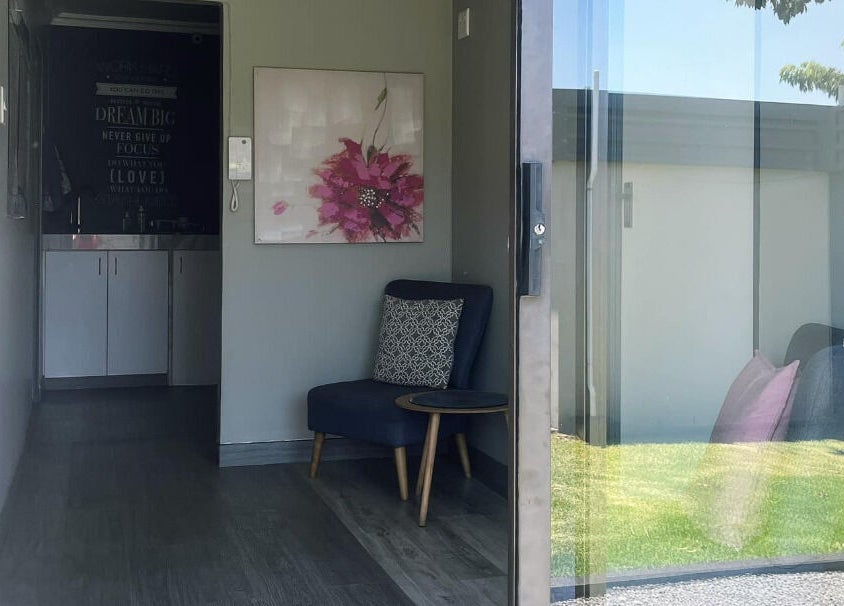 Inviting entry at MS Lashes, Olifantsfontein, Gauteng, ZA, showcasing a chic lounge with modern decor.