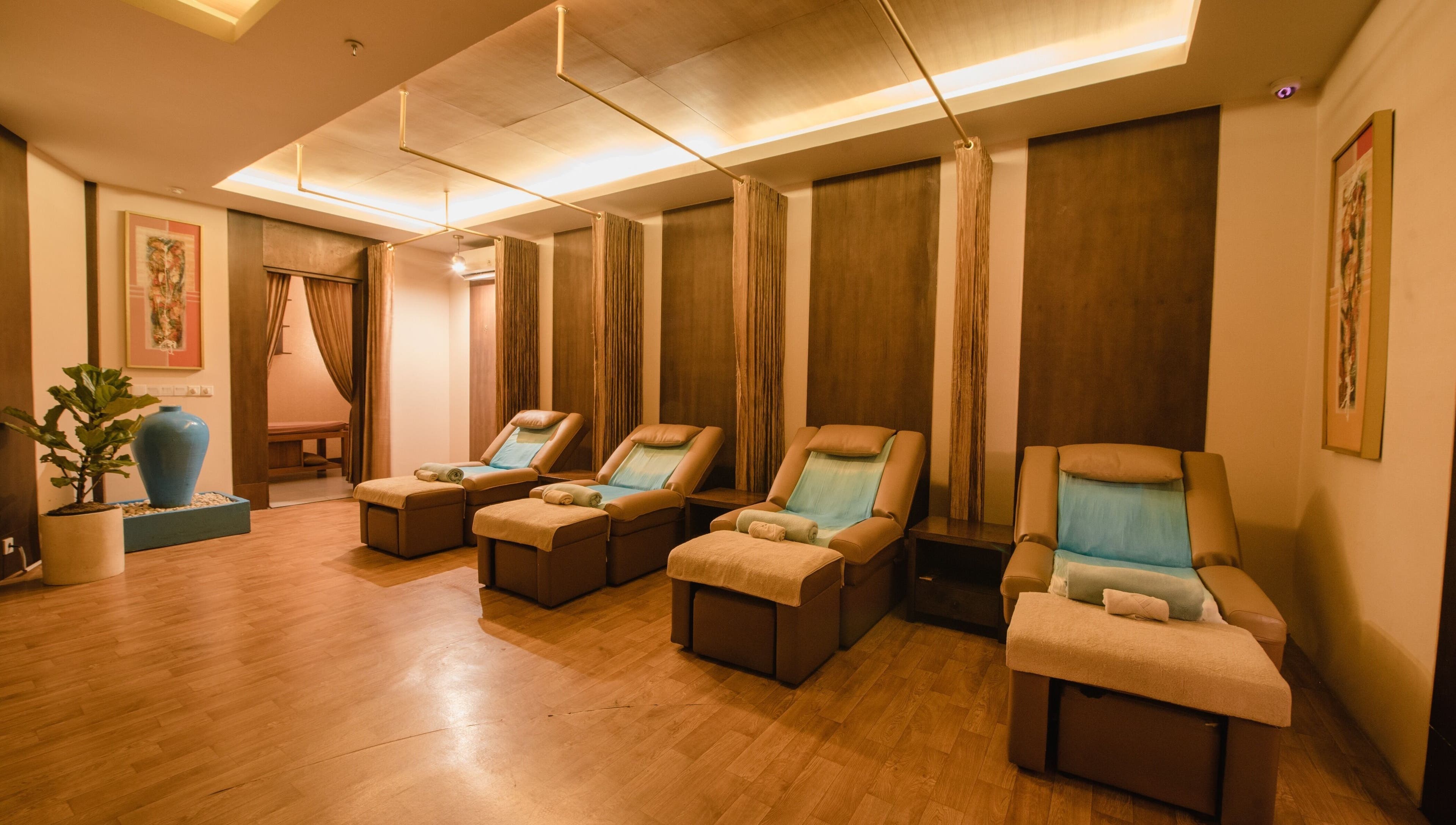 Relaxing massage chairs at Ambiente Reflexology at Sidewalk Jimbaran, Bali. Calm ambiance for ultimate relaxation.