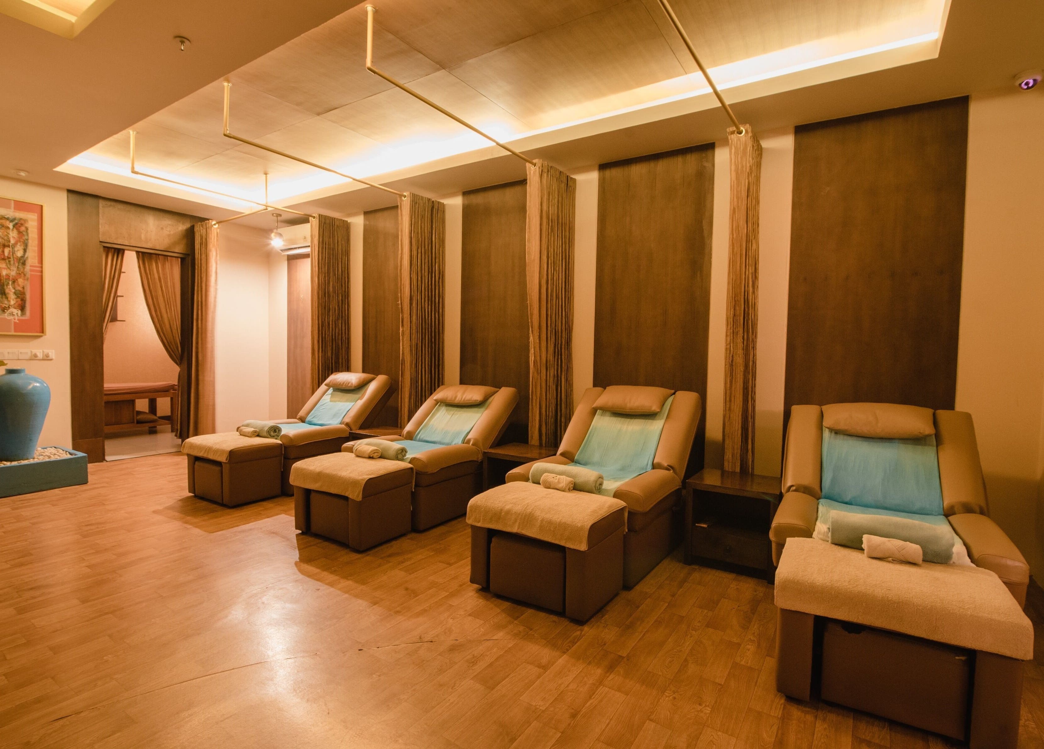 Relaxing massage chairs at Ambiente Reflexology at Sidewalk Jimbaran, Bali. Calm ambiance for ultimate relaxation.