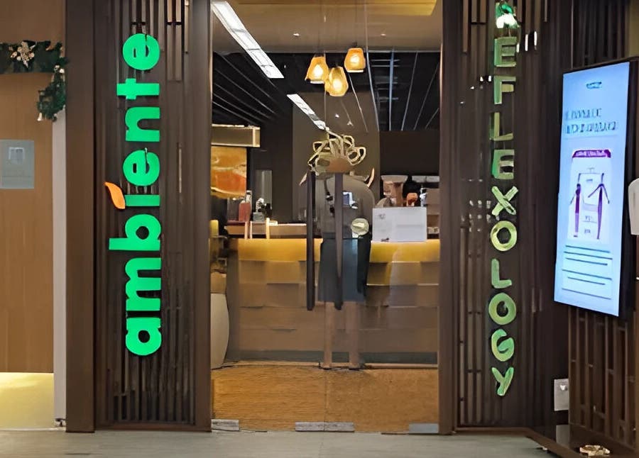 Entrance to Ambiente Reflexology at Sidewalk Jimbaran, Bali, Bali, ID, with vibrant signs and warm lighting.