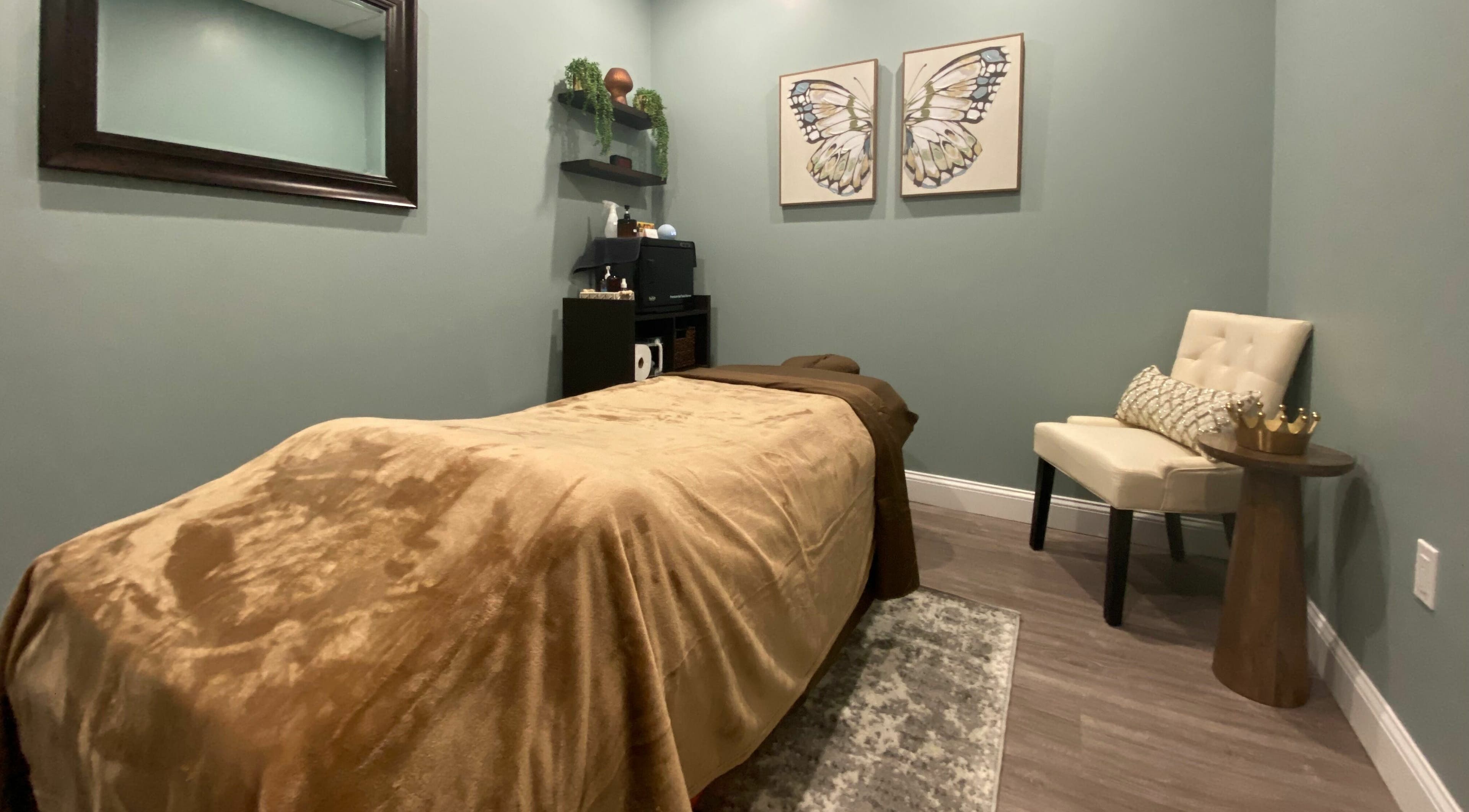 Tranquil spa room at Chhaya Thai Spa in Andover, Massachusetts, US with massage bed and calming decor.