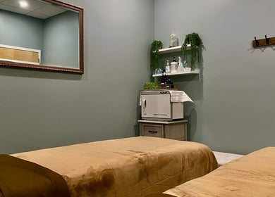 Tranquil massage room at Chhaya Thai Spa Danvers, Danvers, Massachusetts, US with beds and calming decor.