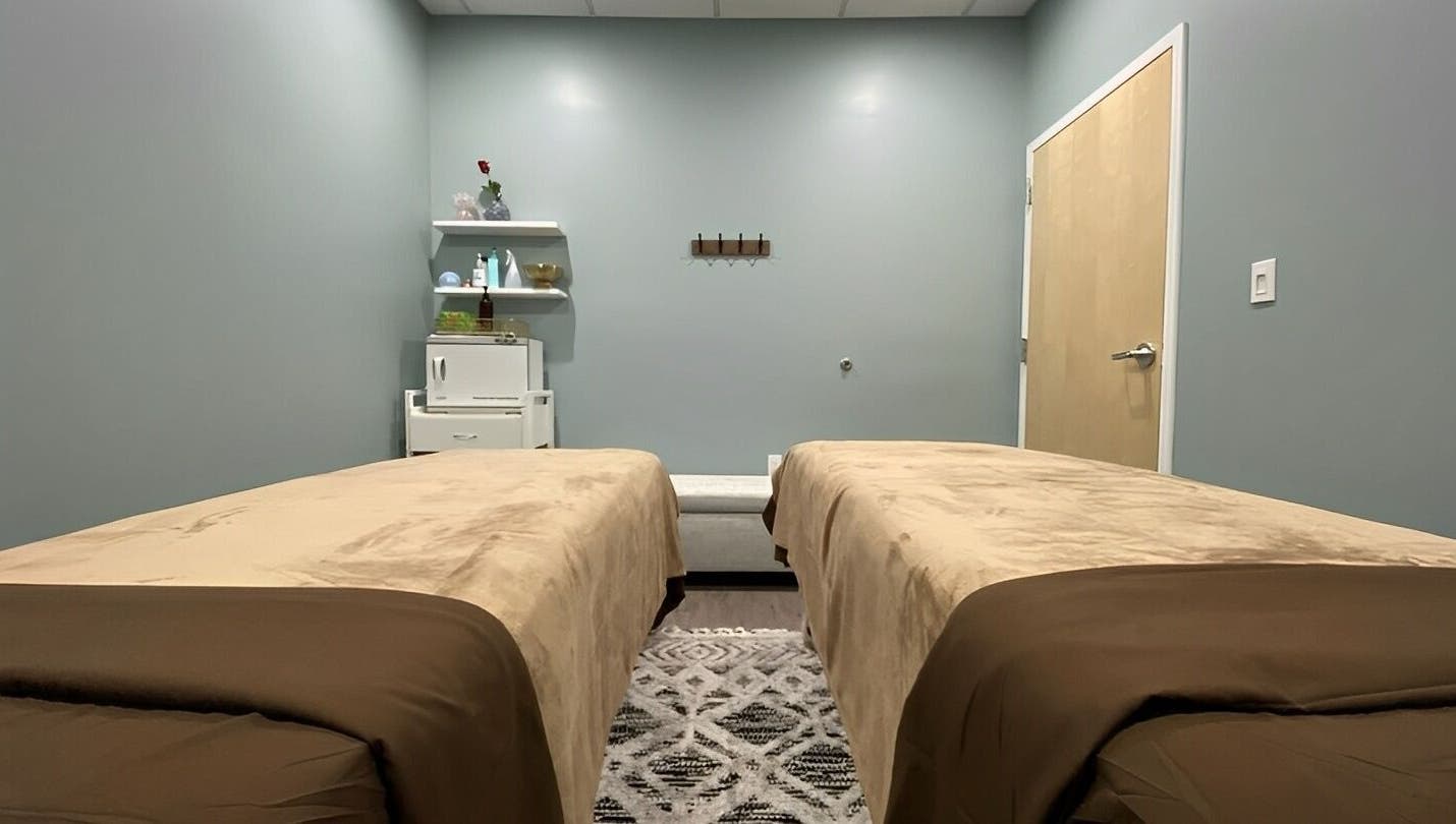 Tranquil massage room at Chhaya Thai Spa Danvers in Danvers, Massachusetts, US, featuring twin massage beds.