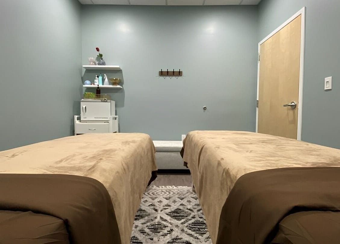 Tranquil massage room at Chhaya Thai Spa Danvers in Danvers, Massachusetts, US, featuring twin massage beds.