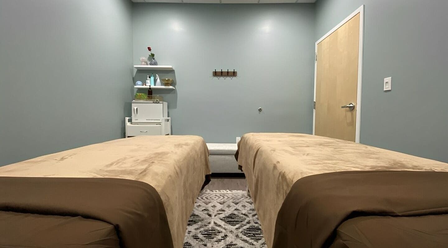 Tranquil massage room at Chhaya Thai Spa Danvers in Danvers, Massachusetts, US, featuring twin massage beds.