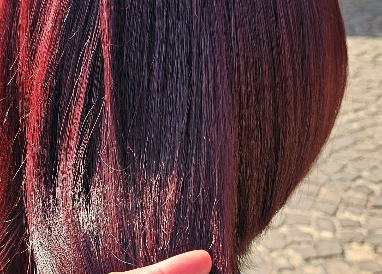 Vibrant red hair style at L and B International, Sandton, Gauteng, ZA showcasing a rich, glossy finish.
