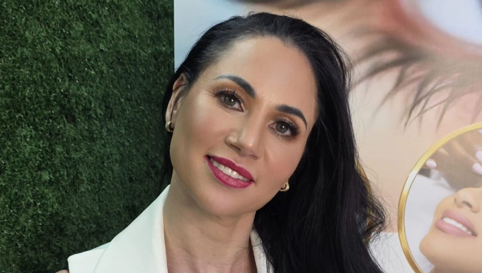 A smiling woman at L and B International, Sandton, Gauteng, ZA, showcasing beauty and elegance.