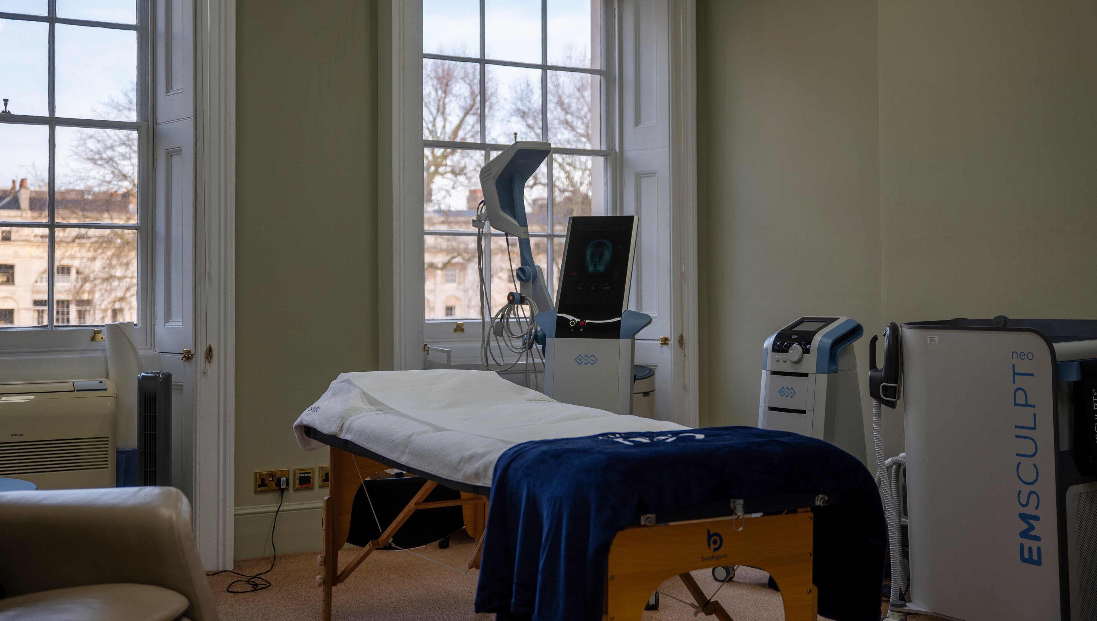 Reshape Clinic [Marylebone] treatment room with equipment, London, England, GB. Bright interiors with large windows.