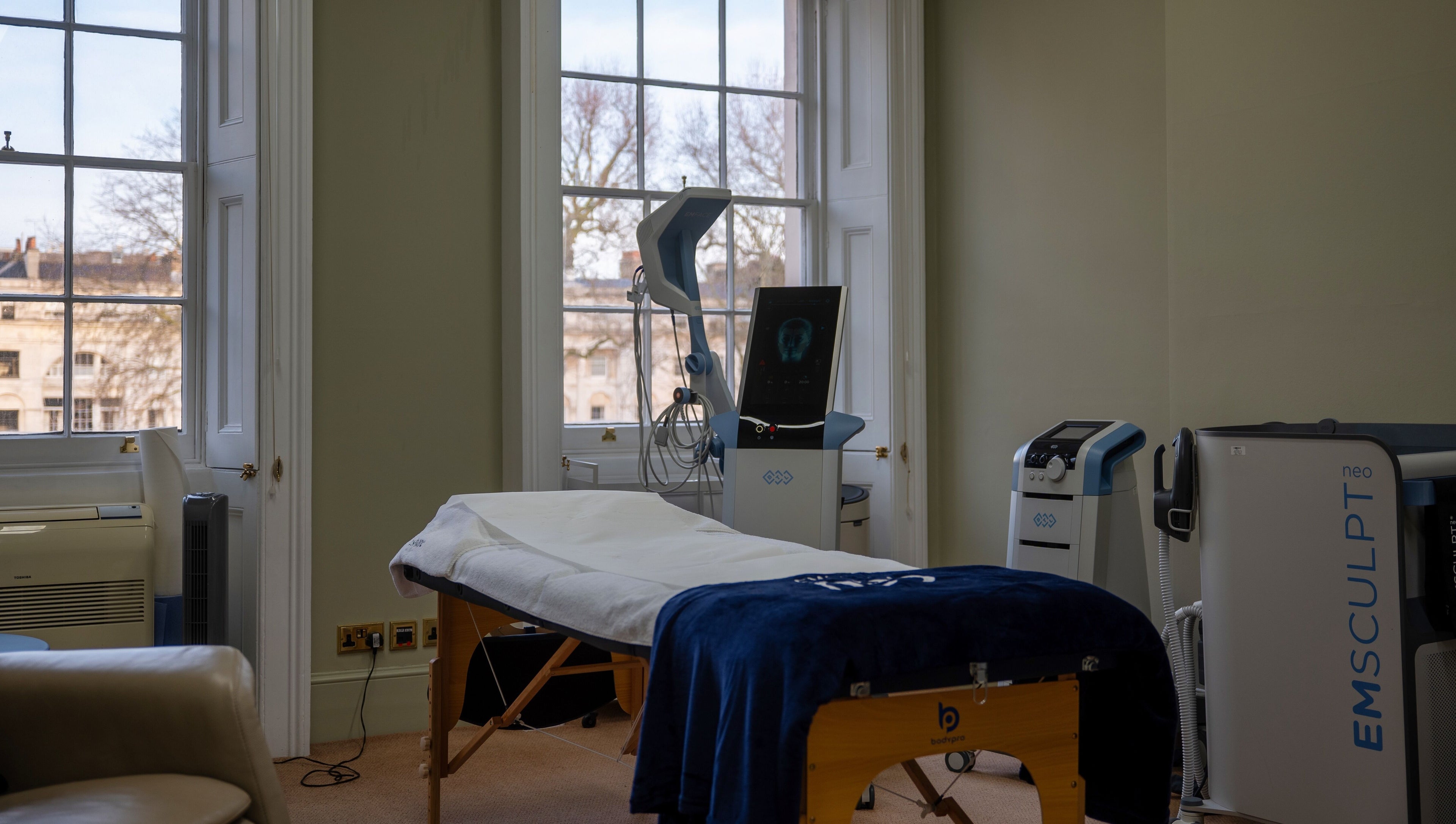 Reshape Clinic [Marylebone] treatment room with equipment, London, England, GB. Bright interiors with large windows.