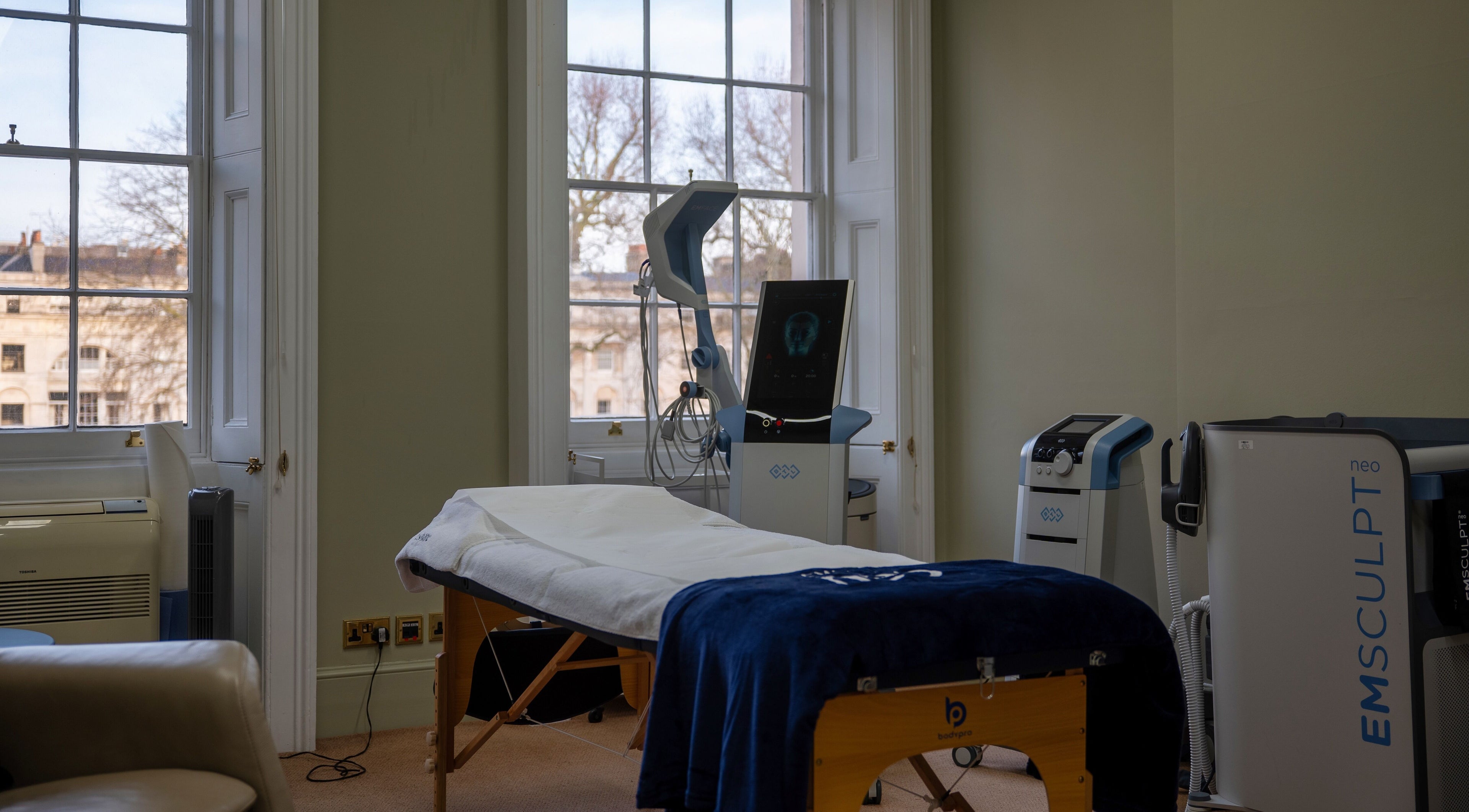 Reshape Clinic [Marylebone] treatment room with equipment, London, England, GB. Bright interiors with large windows.