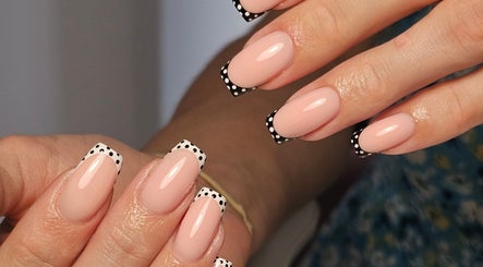 Chic polka dot manicure at Nails by Alissia, Bournemouth, England, GB. Perfect fusion of style and elegance.