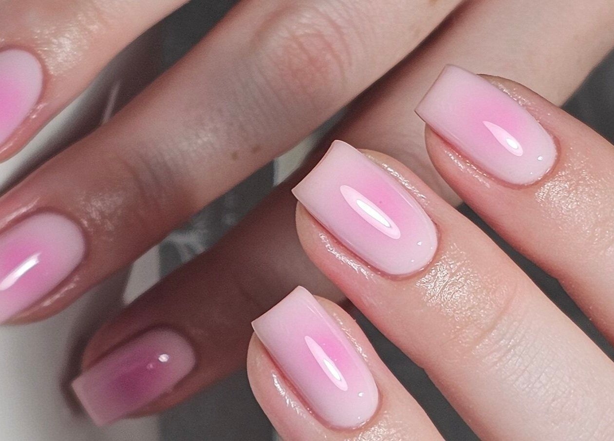 Elegant pink manicure at Nails by Alissia, Bournemouth, England, GB showcasing high-gloss finish.