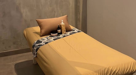 Relaxing massage bed at Adore Nails & Massage in Bali, Bali, ID highlights serene ambiance.