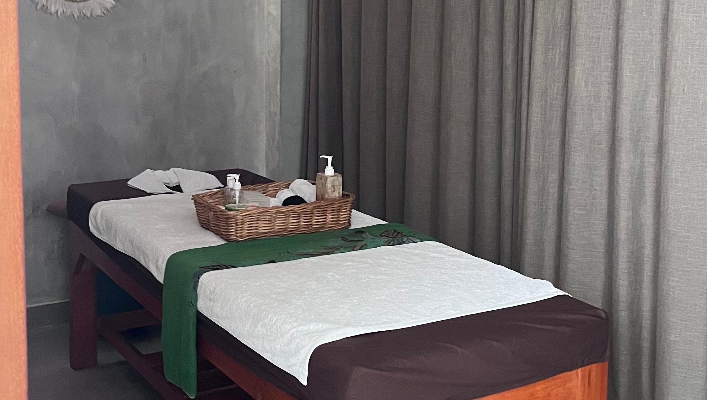 Relaxing massage table setup at Adore Nails & Massage, Bali, Bali, ID with soothing decor.
