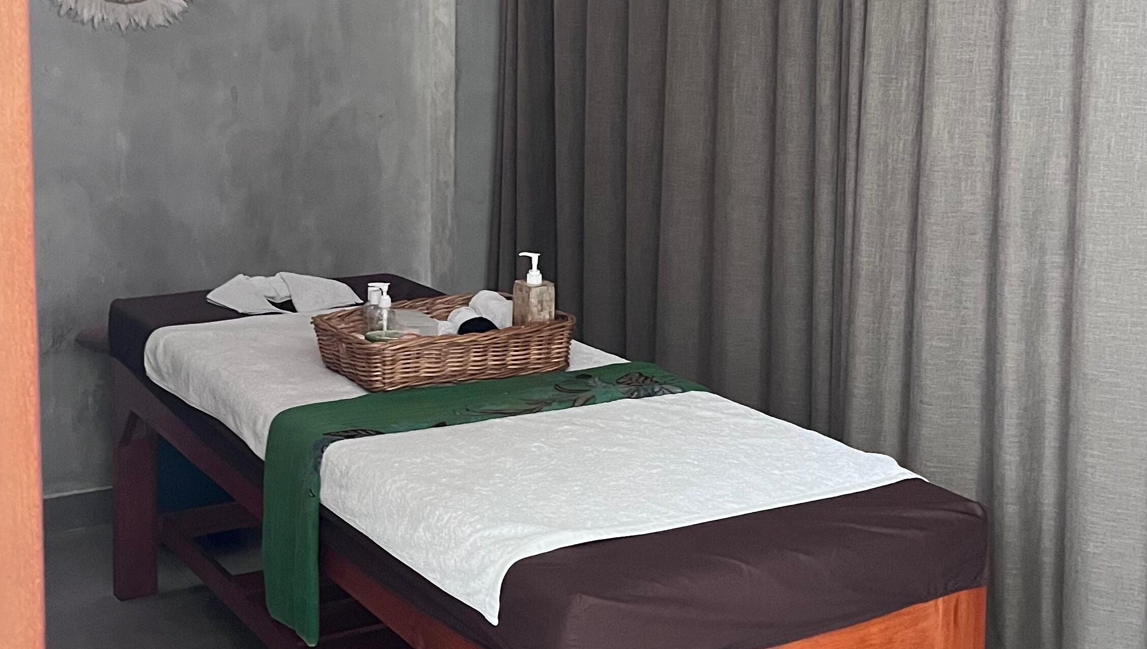 Relaxing massage table setup at Adore Nails & Massage, Bali, Bali, ID with soothing decor.