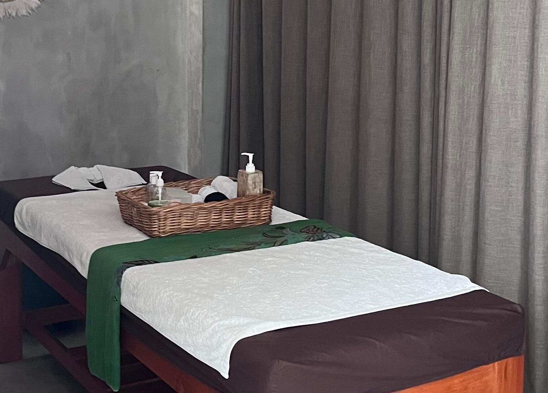 Relaxing massage table setup at Adore Nails & Massage, Bali, Bali, ID with soothing decor.