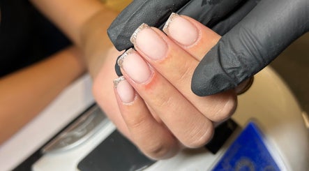Nail artist crafting elegant French manicure at Radiance Aesthetics, Portsmouth, England, GB.