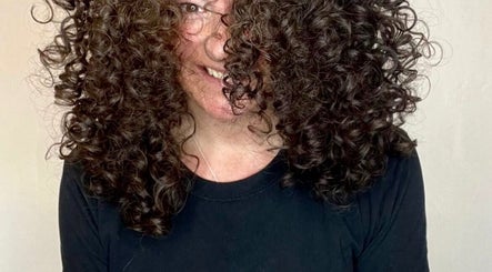 A person with voluminous curly hair smiles at Jordan Alexander @ Bathgate, Bathgate, Scotland, GB.