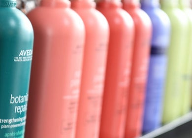 Colorful hair product bottles at Jordan Alexander @ Bathgate (Tues/Wed/Thur), Bathgate, Scotland, GB.