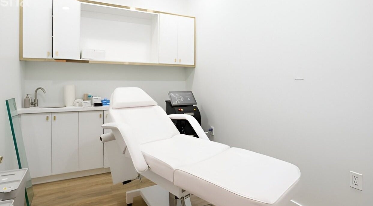 Modern treatment room at Clear Skin Medi Spa, Brampton, Ontario, CA, featuring a luxurious white spa chair.