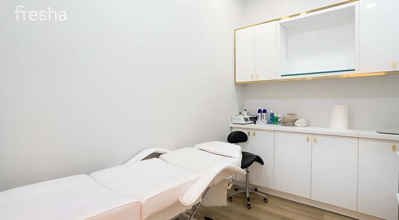 Sleek treatment room at Clear Skin Medi Spa, Brampton, Ontario, CA, showcasing modern white decor.