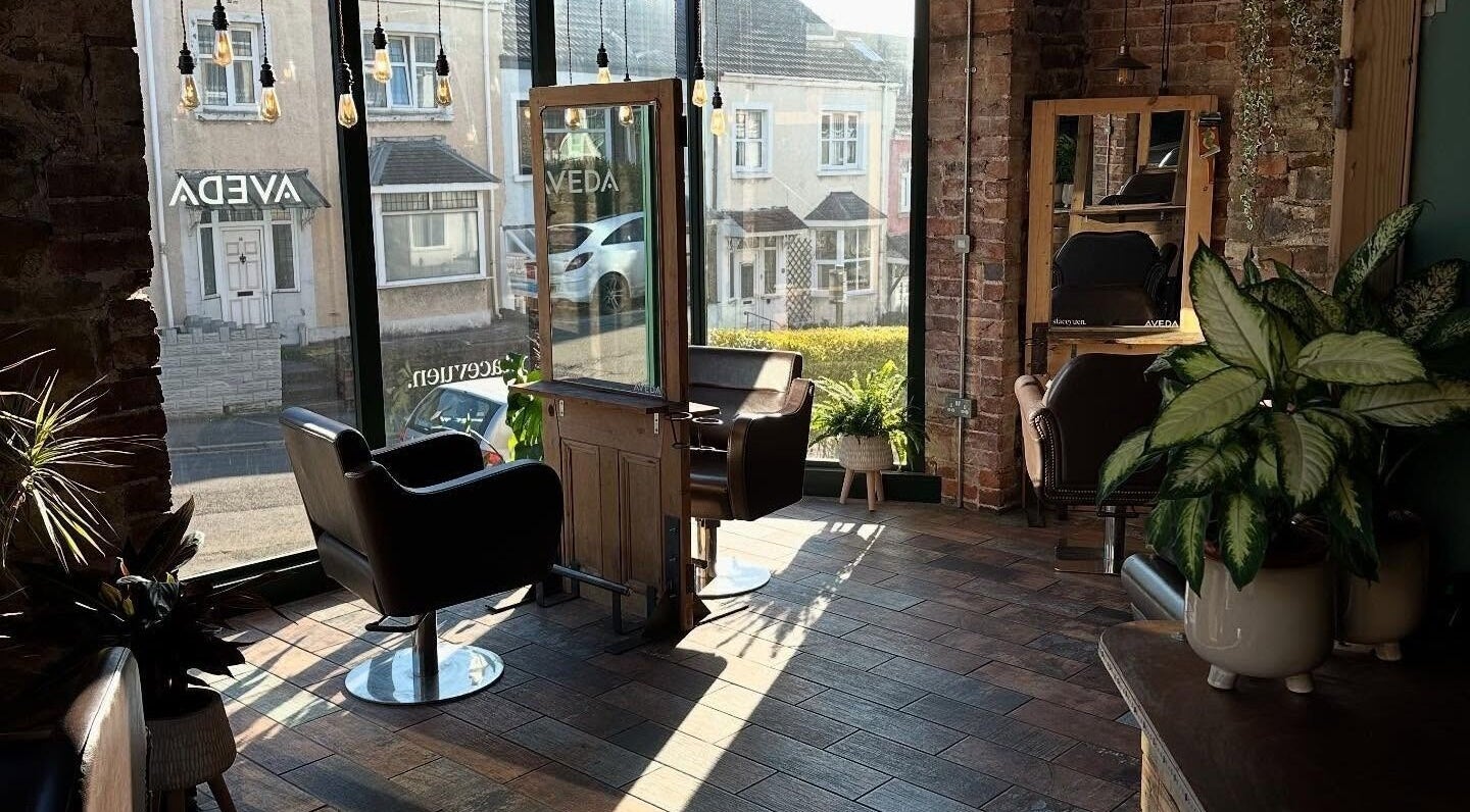 Modern salon interior with stylish chairs at Stacey Yuen Aveda Brynmill, Brynmill, Wales, GB.
