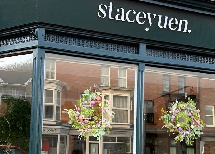Stacey Yuen Aveda Brynmill storefront with floral decor, located in Brynmill, Wales, GB.