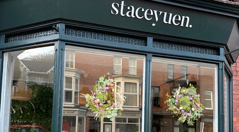 Stacey Yuen Aveda Brynmill storefront with floral decor, located in Brynmill, Wales, GB.
