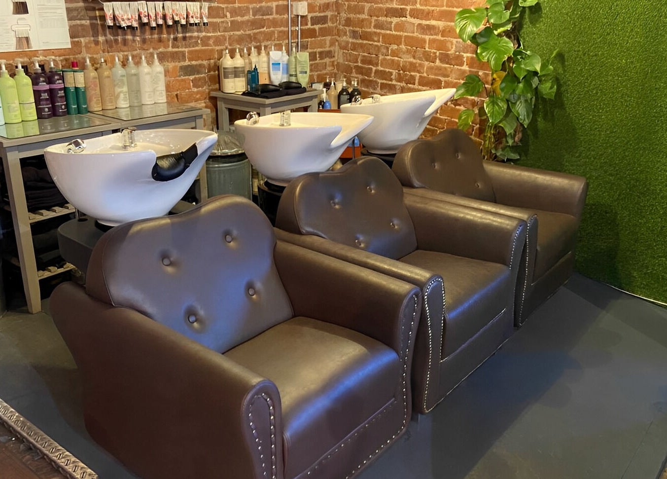 Elegant wash stations at Stacey Yuen Aveda Brynmill in Brynmill, Wales, GB, showcasing stylish design and comfort.