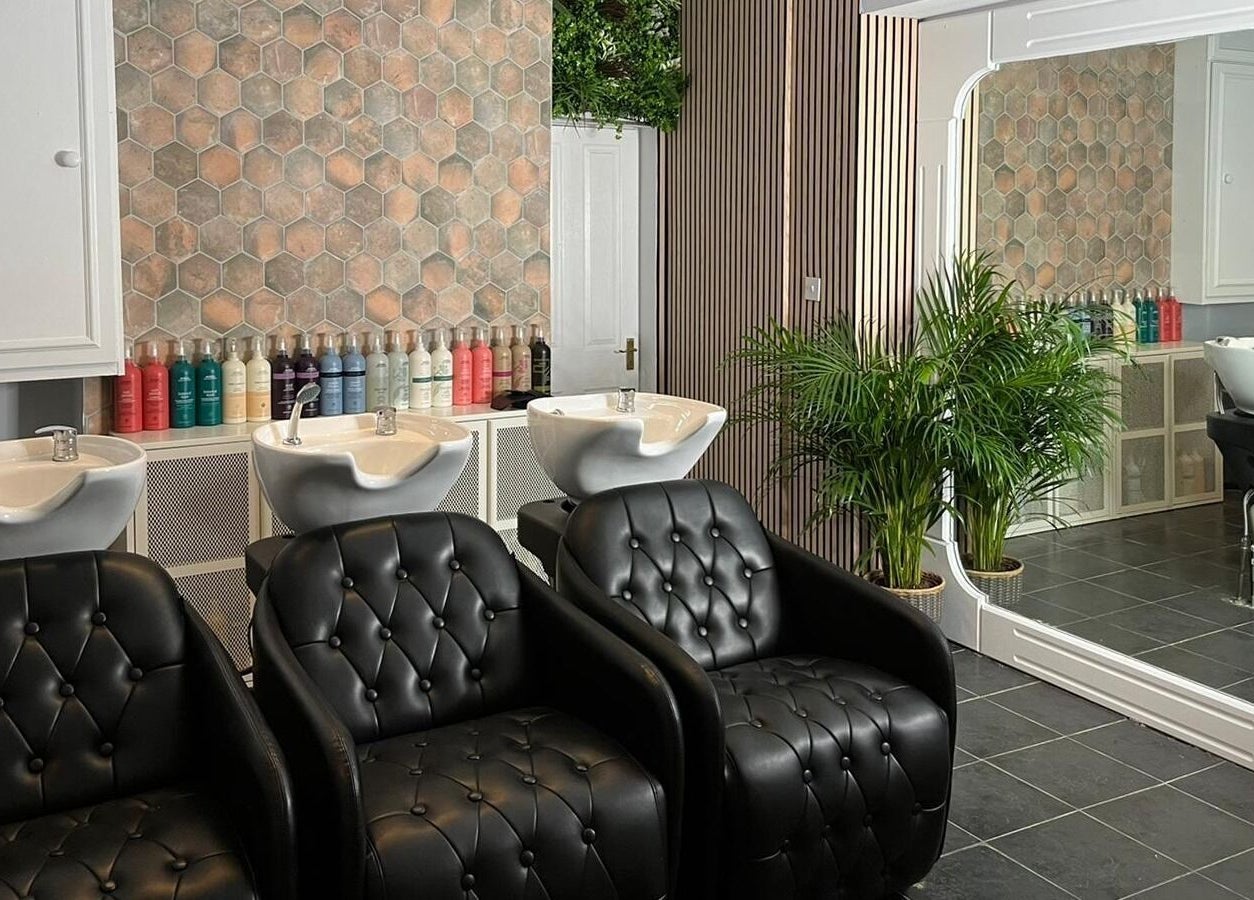 Modern salon with sleek chairs at Stacey Yuen Aveda Mumbles in Swansea, Wales, GB.