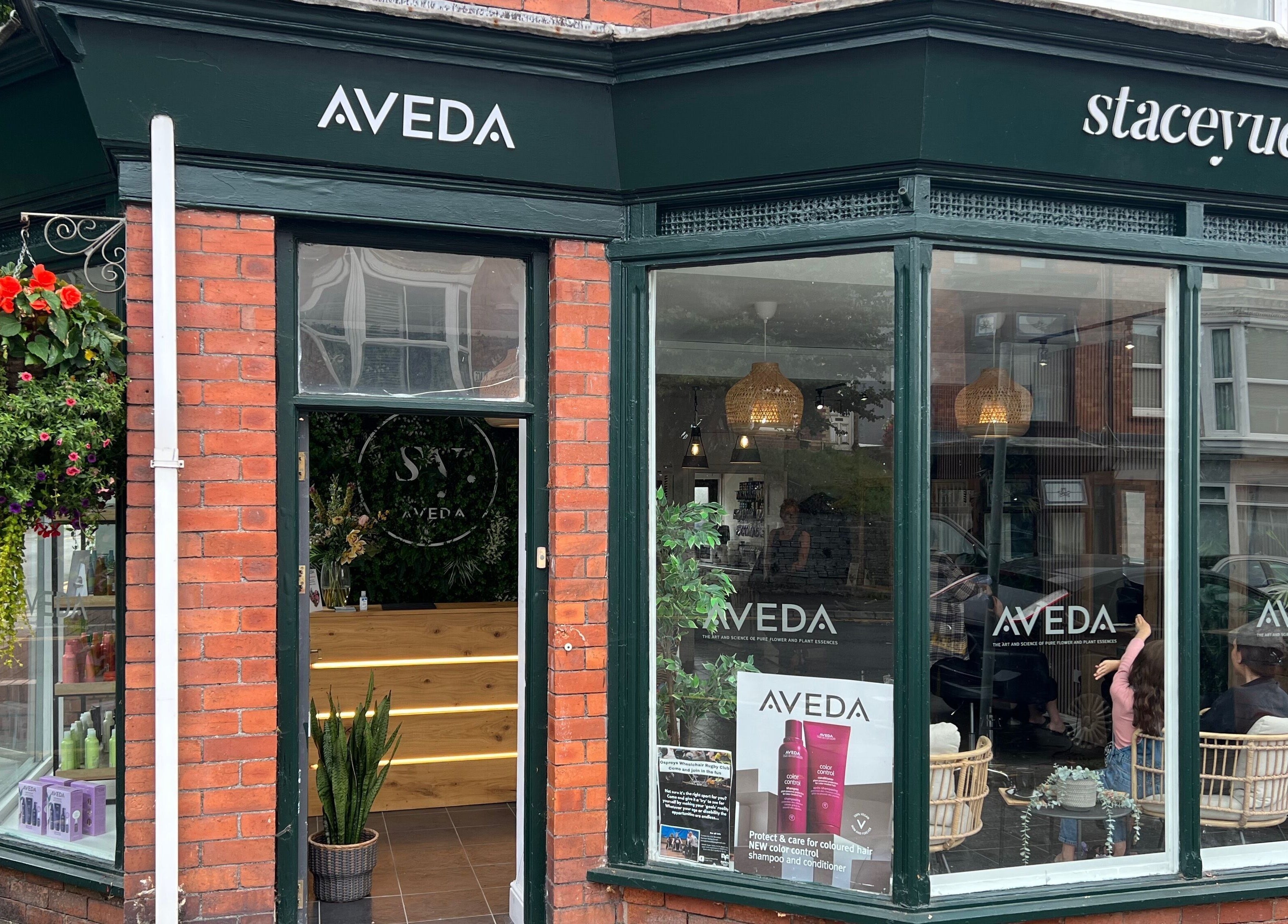 Front of Stacey Yuen Aveda Mumbles beauty salon, Swansea, Wales, GB, showcasing inviting entrance and décor.