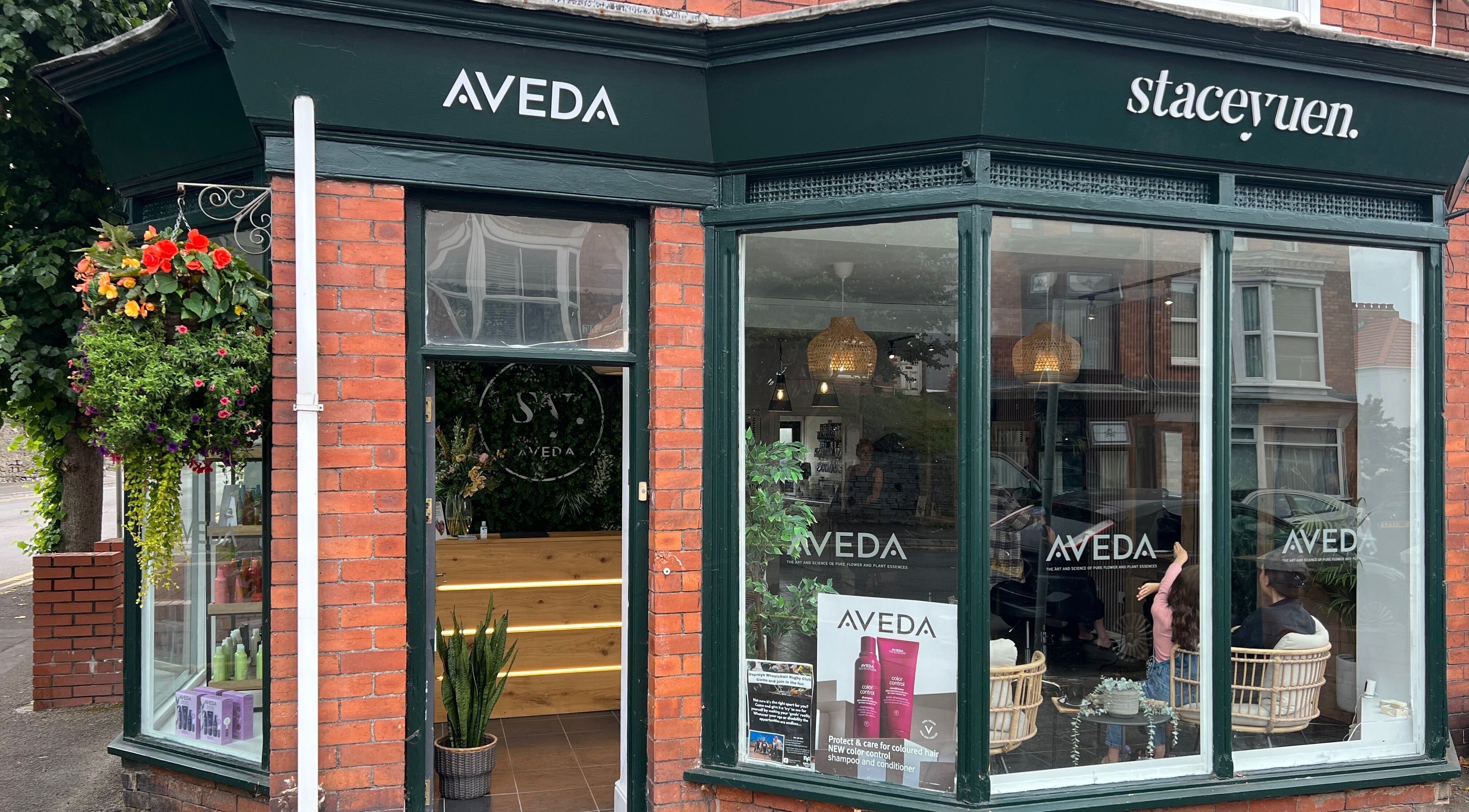 Front of Stacey Yuen Aveda Mumbles beauty salon, Swansea, Wales, GB, showcasing inviting entrance and décor.