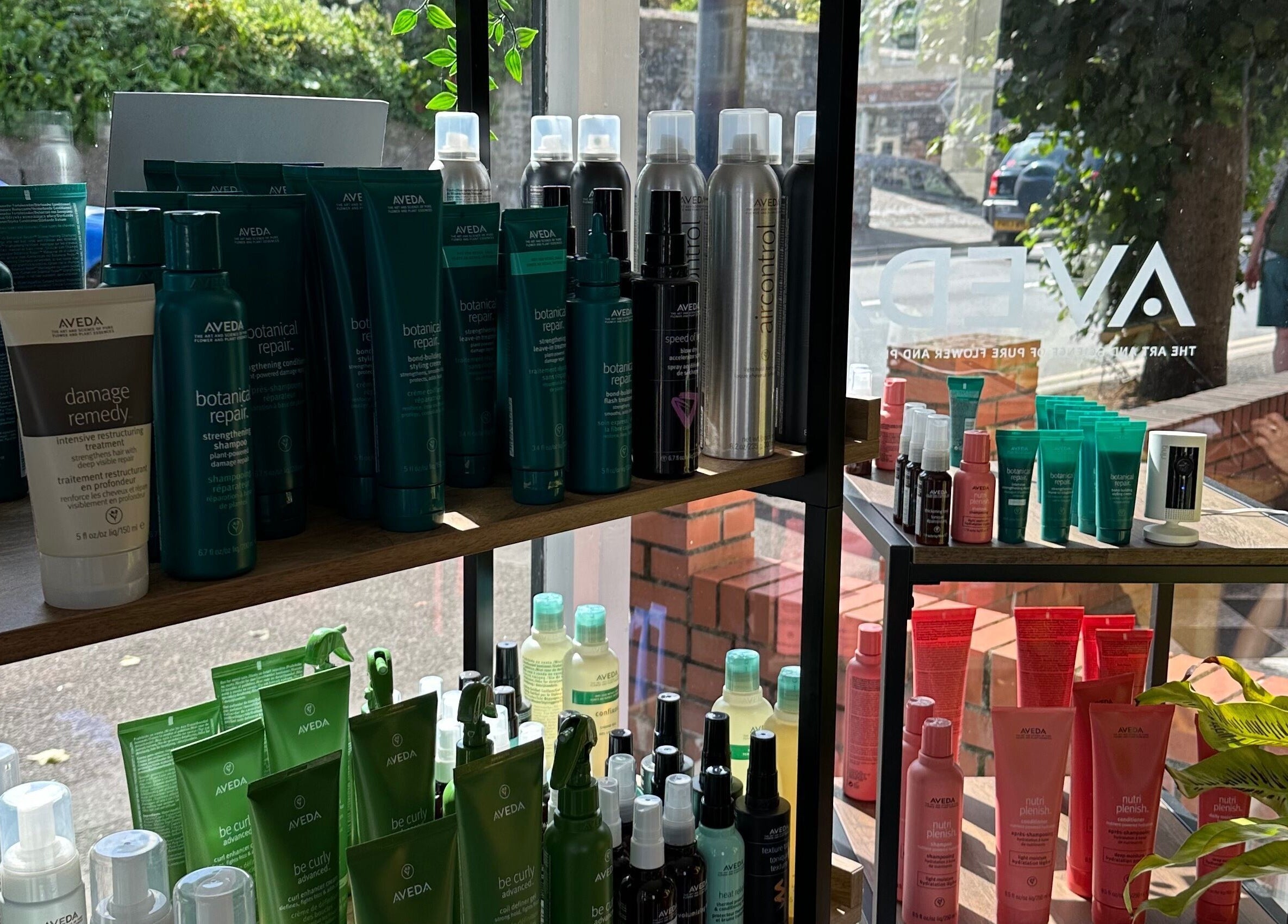 Stacey Yuen Aveda Mumbles in Swansea, Wales, GB featuring Aveda hair products on display shelf.