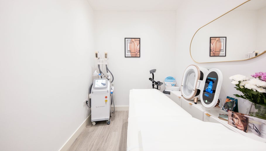 Treatment room at Oxa Beauty in London, England, GB with modern equipment and minimalist decor.