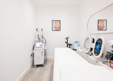 Treatment room at Oxa Beauty in London, England, GB with modern equipment and minimalist decor.