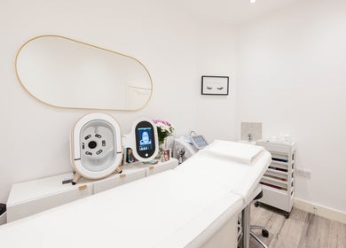 Modern treatment room at Oxa Beauty, London, England, GB featuring sleek equipment and serene decor.
