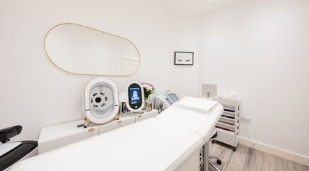 Modern treatment room at Oxa Beauty, London, England, GB featuring sleek equipment and serene decor.