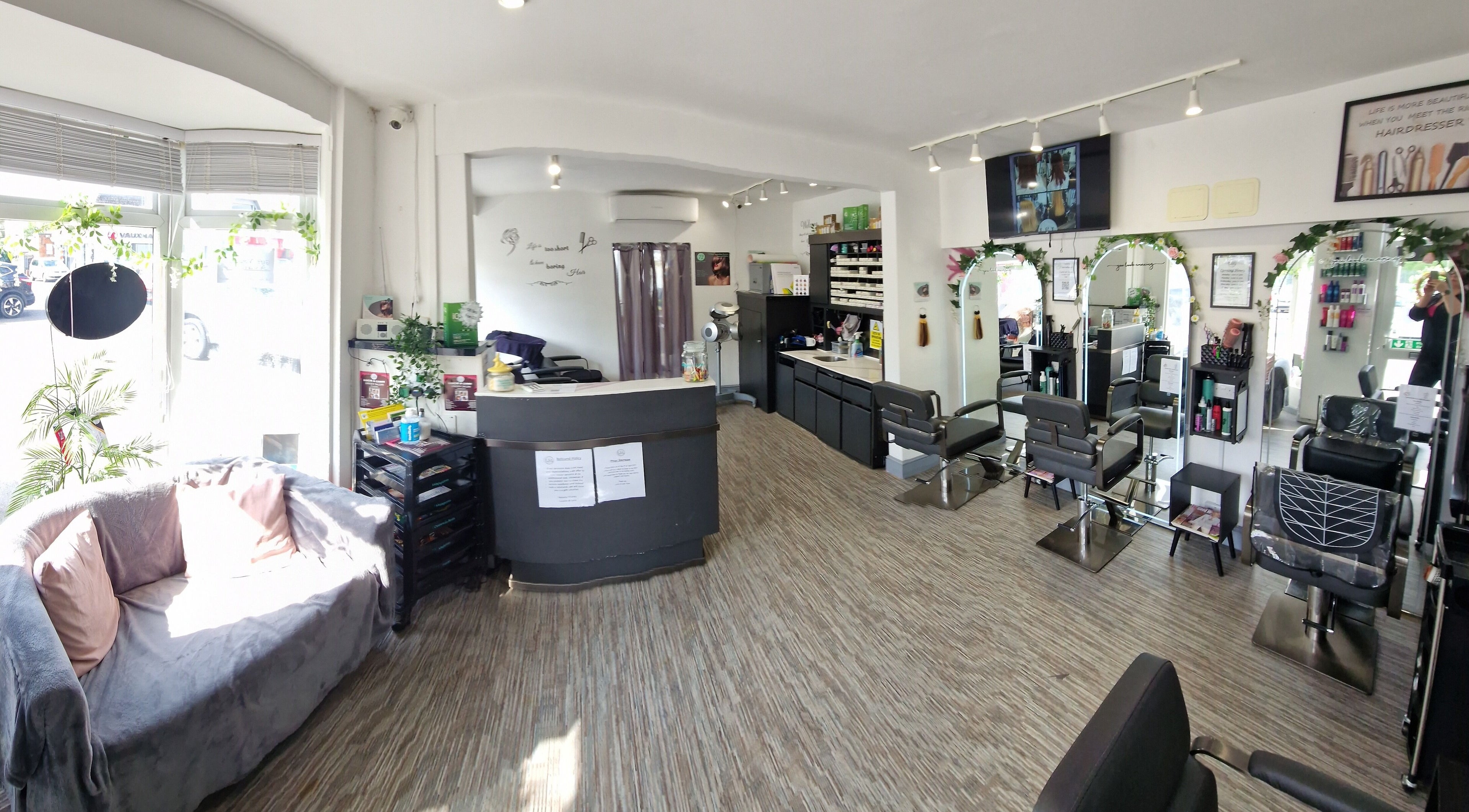 Elegant interior of Lucie And Lynn salon in High Wycombe, England showcasing modern styling stations.