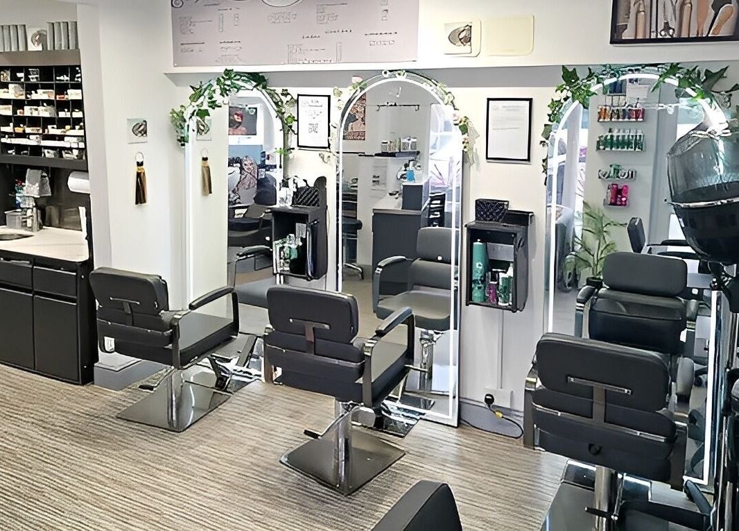Elegant salon setup at Lucie And Lynn, High Wycombe, England, GB with mirrors and styling chairs.