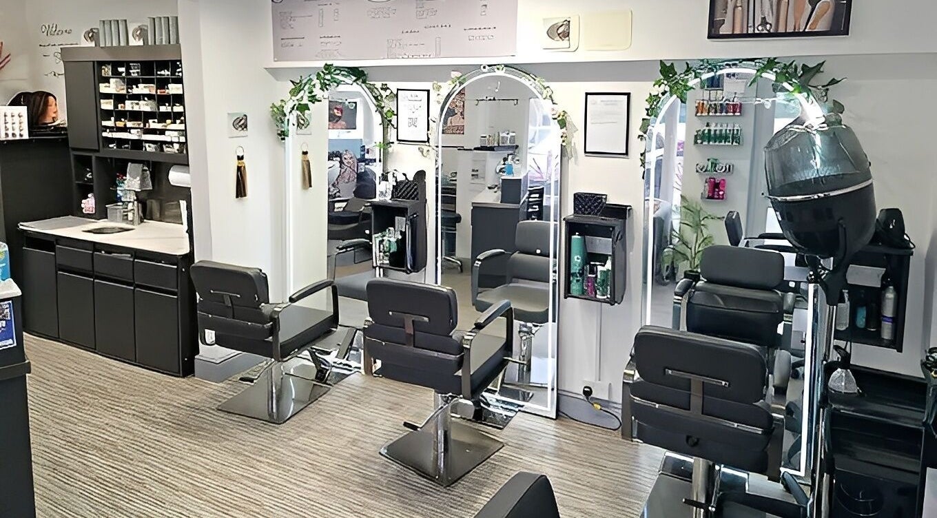 Elegant salon setup at Lucie And Lynn, High Wycombe, England, GB with mirrors and styling chairs.
