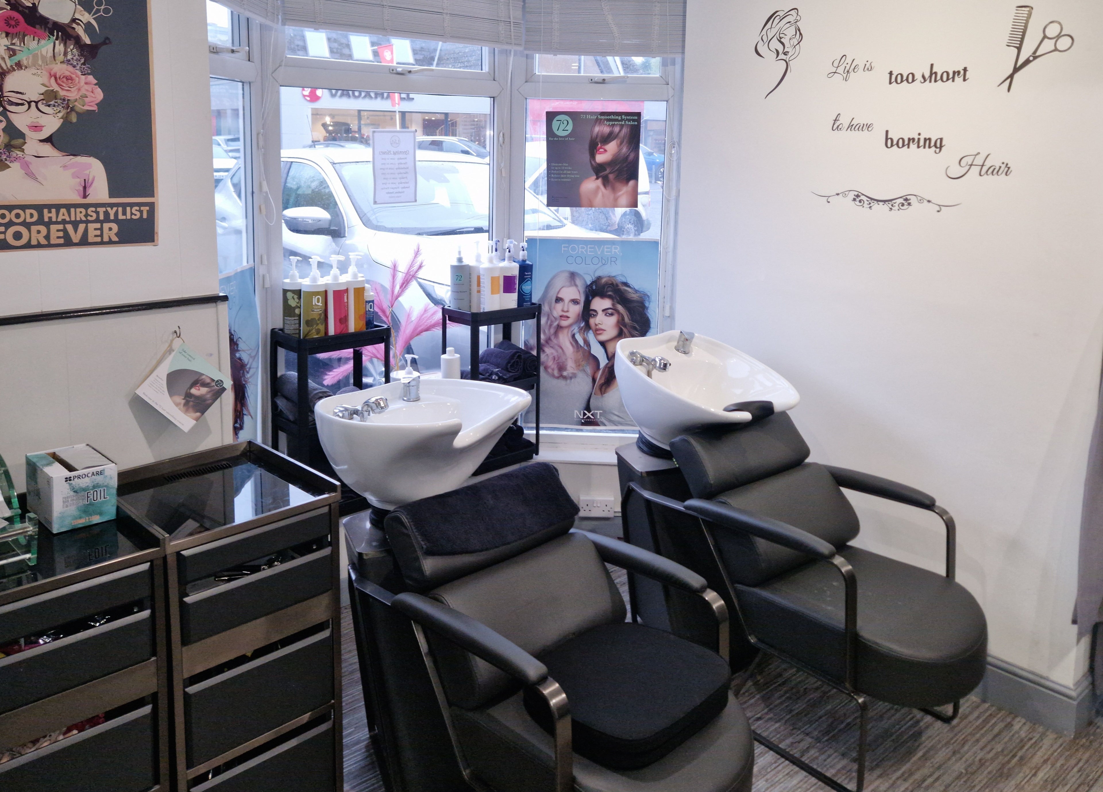 Stylish hair salon chairs and wash basins at Lucie And Lynn, High Wycombe, England, GB.